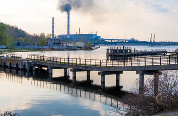 Kyiv region , Ukraine - April 21, 2019: View of the Tripilska TPP from the bank of the Dnieper River in the city of Ukrainka, Kiev region, Ukraine