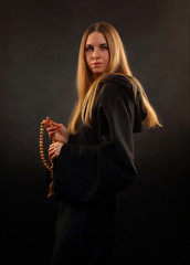 Beautiful girl in medieval monastic robes