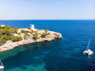 Fototapeta premium Aerial view, Cala Pi bay, beach and rocky coast, Torre de Cala Pi, Llucmajor municipality, Mallorca, Balearic Islands, Spain