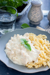 Chicken breast fricassee with pasta, selective focus