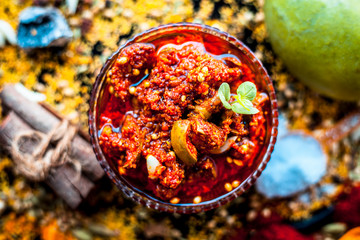Popular Indian & Asian pickle of mango in a glass bowl i.e. Aam ka achar in a glass bowl or keri ka...