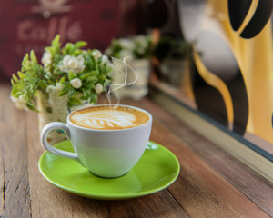Cup of art latte or cappuccino coffee.