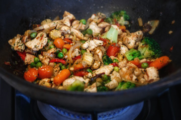 turkey meat stew with fresh vegetables cooked in a wok pan