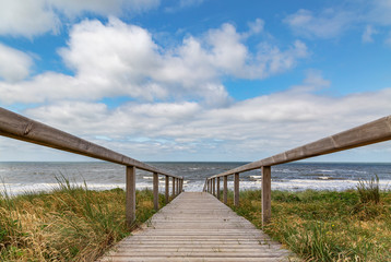 Obraz premium View to wooden path to access the Rantum Beach at Sylt / Germany