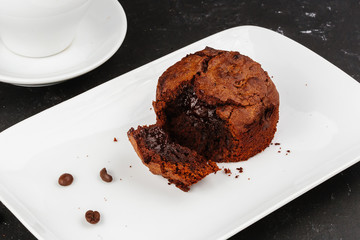 Dessert with hot chocolate muffin and ice cream on a black background.