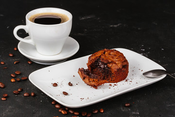 Dessert with hot chocolate muffin and ice cream on a black background.