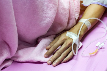 medical concept; top view picture of  Pricking needle syringe in the hand back patient,Give medicine to the line , Injection intravenously