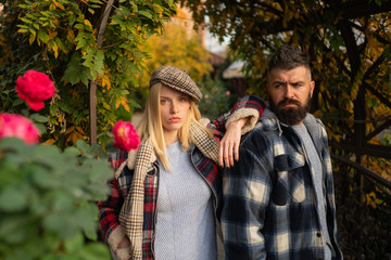 Stylist service. Lumberjack style. Couple wear checkered clothes nature background. Man bearded...