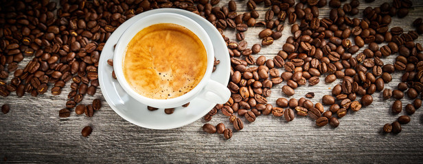 Panorama banner of hot espresso coffee with beans