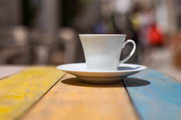 Coffee on the wooden colorful table