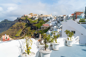 Santorini landscape with traditional whitewashed buildings in Fira , Greece
