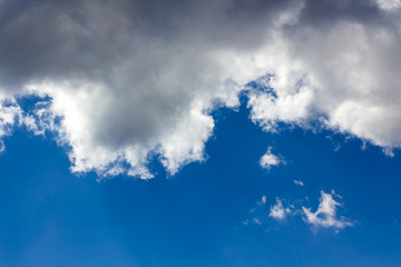 Obraz premium White fluffy clouds in the blue sky