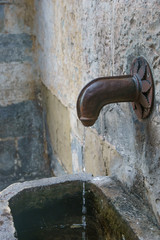 a metal penis-shaped fountain in Bergamo, Italy, Europe