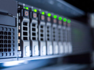 Blurred background of storage server LED status in data center server room