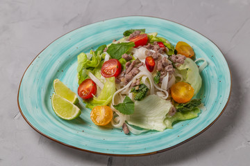 Spicy Thai salad with ground beef and rice noodles