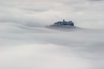 Unique Spis (Spiš, Spišský) castle in the mist. Second biggest castle in Middle Europe, Unesco Wold Heritage, Slovakia