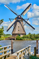 Netherlands rural lanscape with windmills at famous tourist site Kinderdijk in Holland. Old Dutch village Kinderdijk, UNESCO world heritage site. 