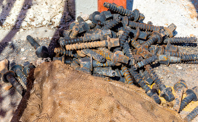 Close up bolted butt of rails and wooden sleepers laid on groundwork crushed stone. Railway...