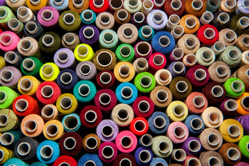 Multicolored Bobbin of thread. top view.