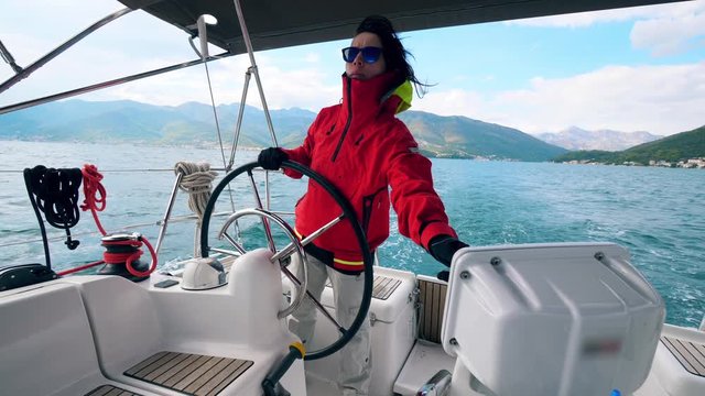Sailing boat is being managed by a woman