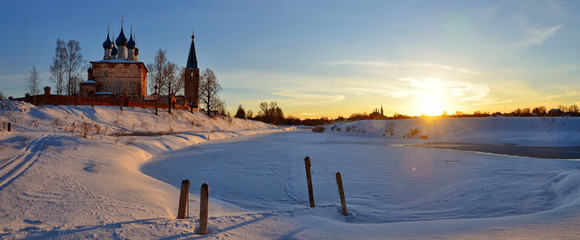 Naklejka premium Beautiful landscape of Dunilovo village church and sunrise
