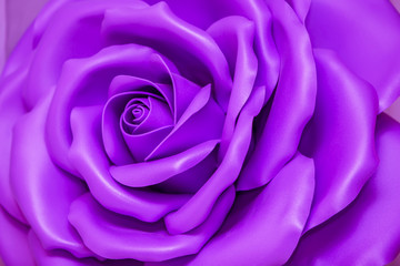 Huge Artificial Violet Rose Background.Flower closeup