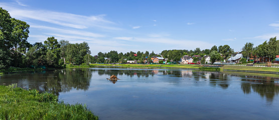 Fototapeta premium Landscape with a lake in the countryside