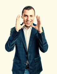 Man in a suit raised both hands up the joy of victory delight