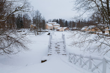 An old manor house Vihula in Estonia, Lahemaa park. Beautiful winter views with bridges and frozen ponds.