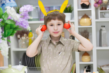 Boy playing with easter eggs