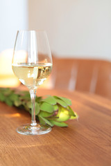 Glass of white wine at the restaurant table