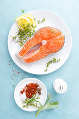 Fresh raw salmon fish steak with ingredients for cooking