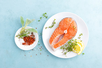 Fresh raw salmon fish steak with ingredients for cooking