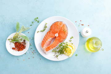 Fresh raw salmon fish steak with ingredients for cooking