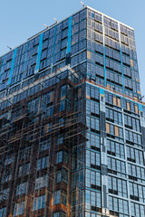 Tall modern building in Downtown Brooklyn, still under construction, New York City, NY, USA