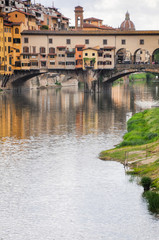 Ponte Vecchio or Old Bridge is a medieval stone bridge over the Arno River, in Florence, Italy. It's noted for having shops on in. Photos taken right after the rain as the sun was coming out.