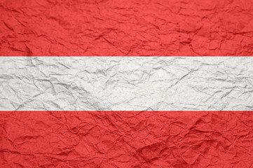 Austria flag on old crumpled craft paper.