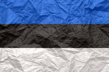 Estonia flag on old crumpled craft paper.