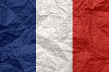 France flag on old crumpled craft paper.