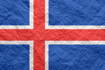 Fototapeta premium Iceland flag on old crumpled craft paper.
