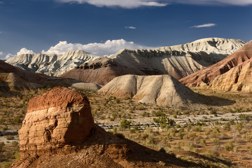 Erosion of red and white sedimentary layers at Aktau Mountains Altyn Emel Park Kazakhstan