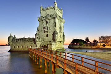 Torre de Belem (Belem Tower), in the Tagus river, a UNESCO World Heritage Site built in the 16th century in Portuguese Manueline Style at twilight. It was designed by the architect Francisco de Arruda. Lisbon, Portugal