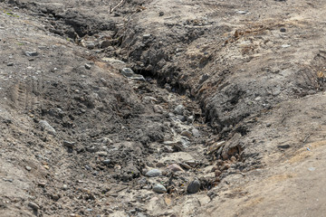 After rain the creek washed away the road
