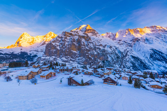 M&cedil;rren, Berner Oberland, canton of Bern, Switzerland. The village with Eiger, M&circ;nch and Jungfrau in the backdrop at sunset