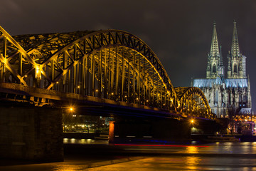 dom of cologne and hohenzollern bridge at night