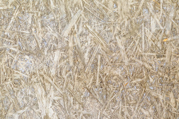 texture. imprint on the concrete screed osb plate. daylight. there is tinting.