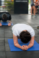 Fototapeta premium Gym members doing plank exercise