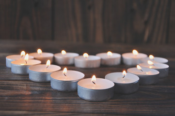 Burning candles in the shape of a heart. Romance for Valentine's Day. Love.