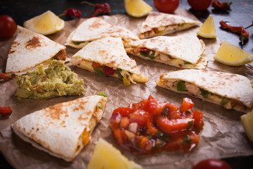 Mexican quesadilla, tortilla filled with cheese, meat and vegetables