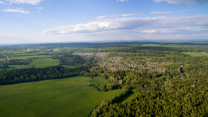 Fototapeta premium fields, forests, sky with clouds view from above